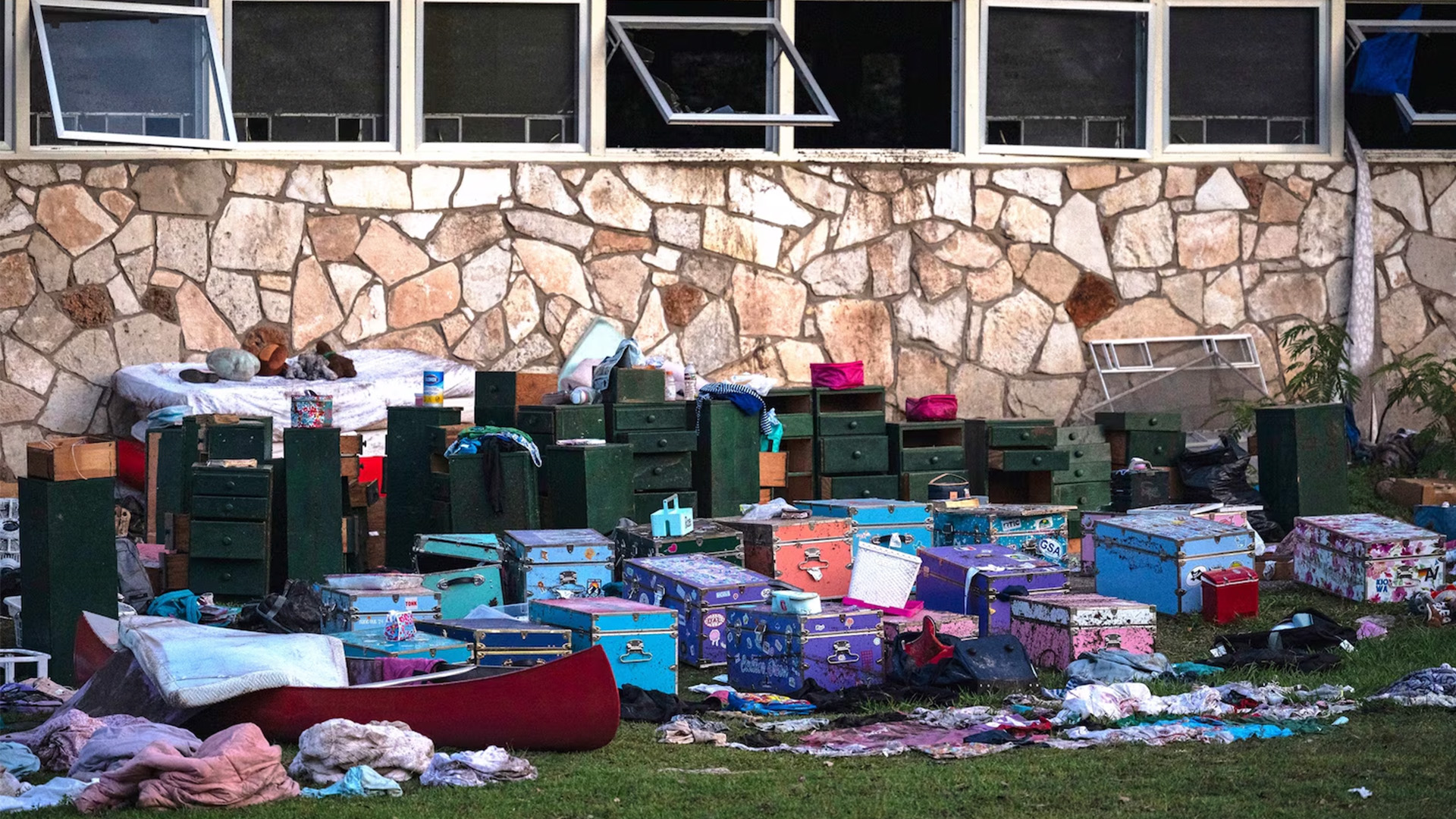 Camper's belongings sit outside one of Camp Mystic's cabins near the Guadalupe River after a flash flood swept through the area, July 7, 2025, in Hunt, Texas.